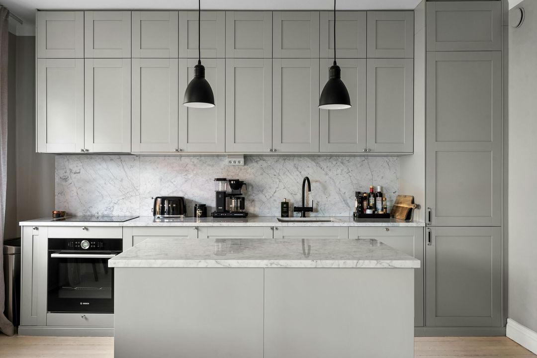 Sample kitchen with white Shaker cabinets