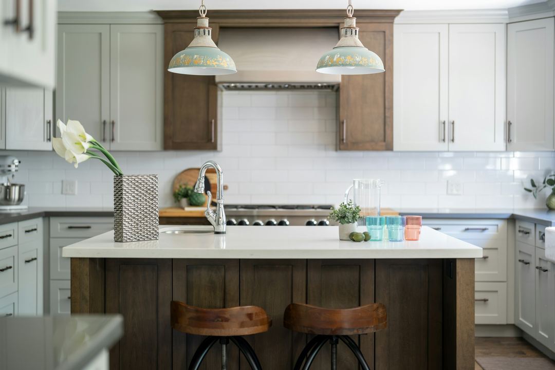 Shaker cabinets with a wood hood and island
