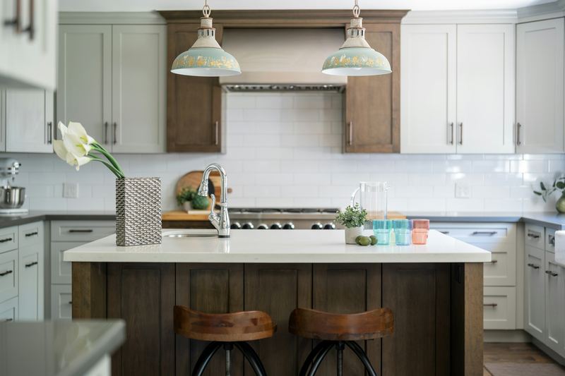 Shaker cabinets with a wood hood and island